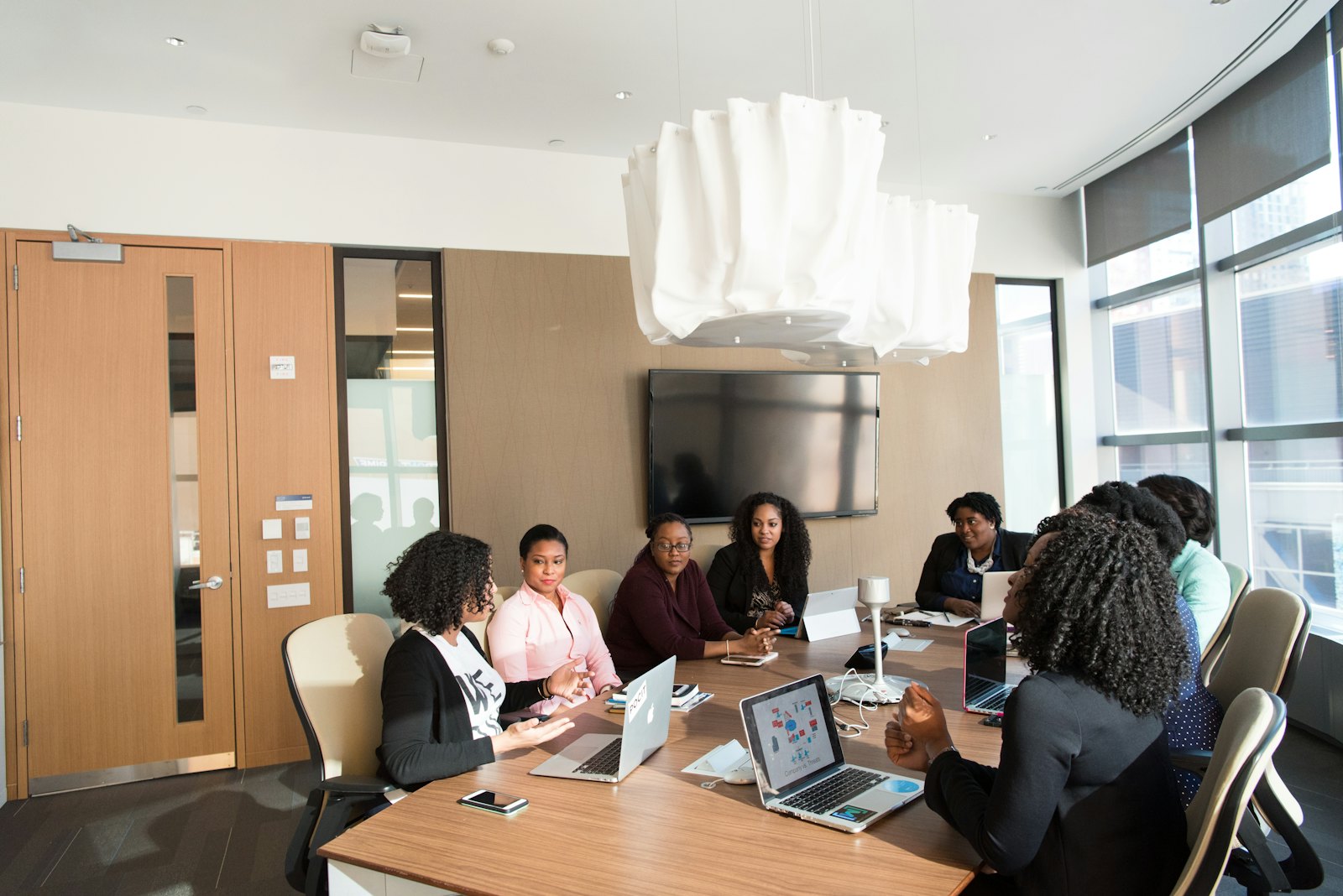 Colleagues in a bright meeting room